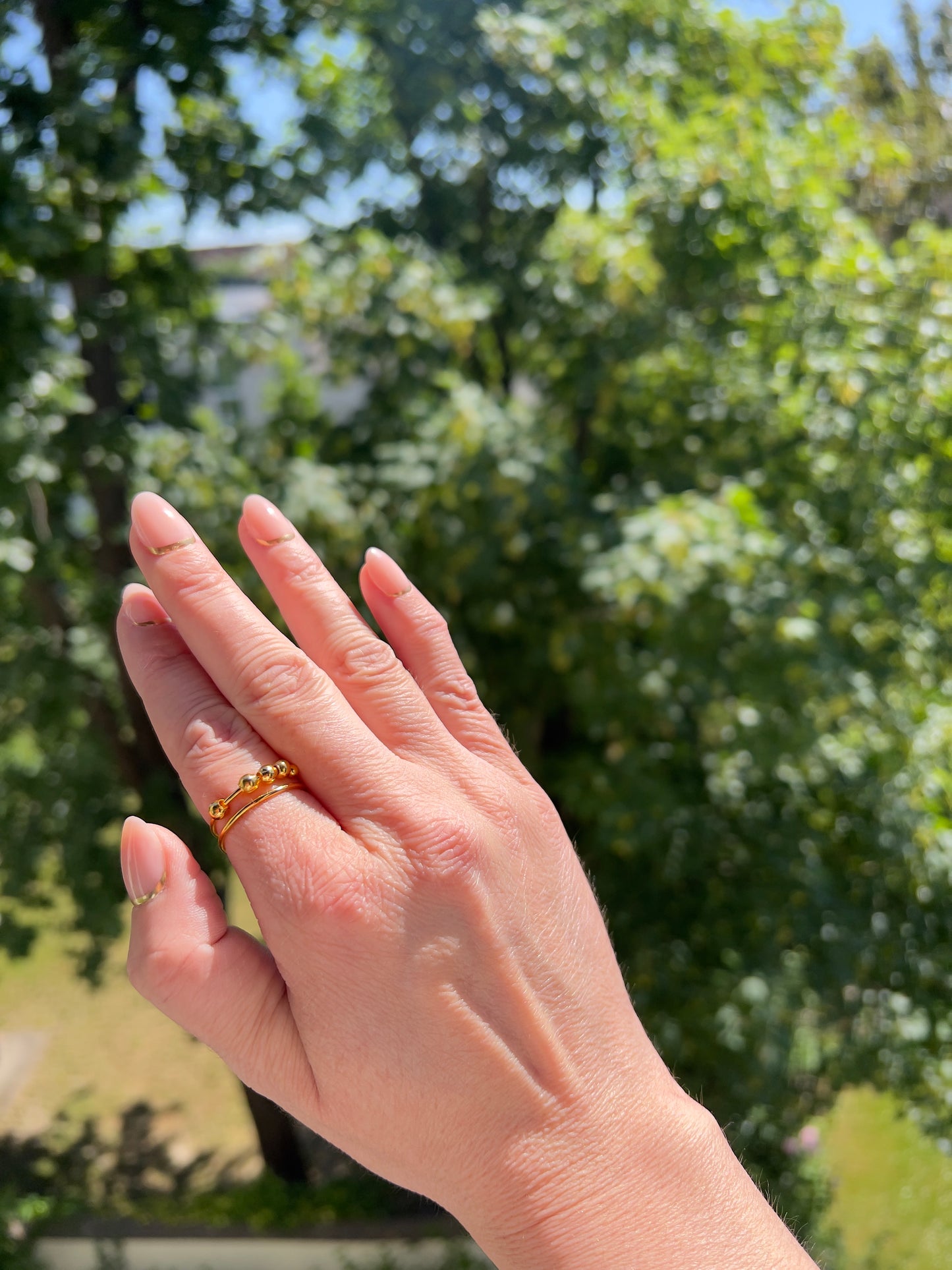 Rain or Shine Fidget-Ring – Drehbarer Anti-Stress-Ring in Goldoptik